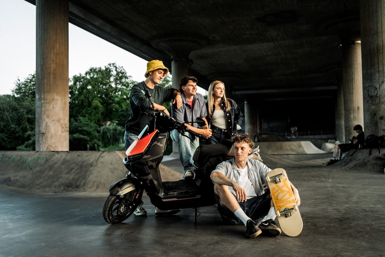 Crew and riders during a shoot day under a city bridge